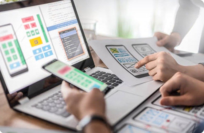 stock image of people planning in front of a laptop