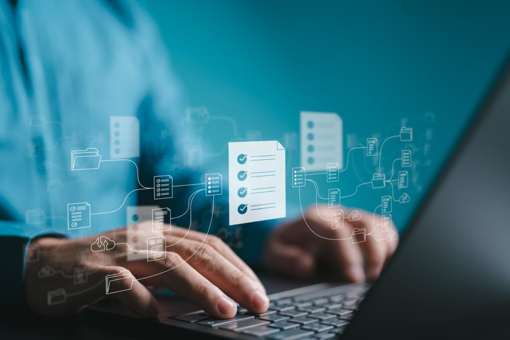A stock image showing: A design system with a main file in the middle. In the background you see hands on a keyboard.